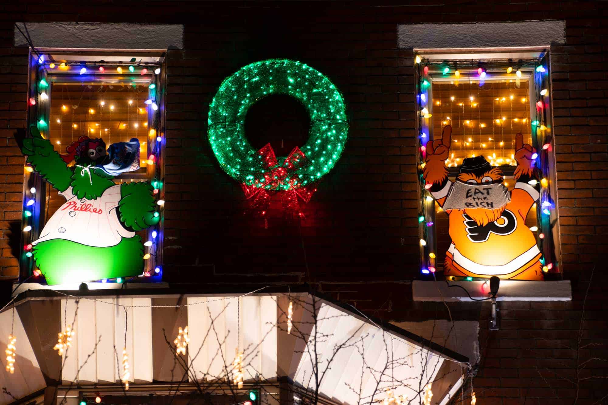 Christmas wreath with Gritty and the Philly Phanatic in the windows.