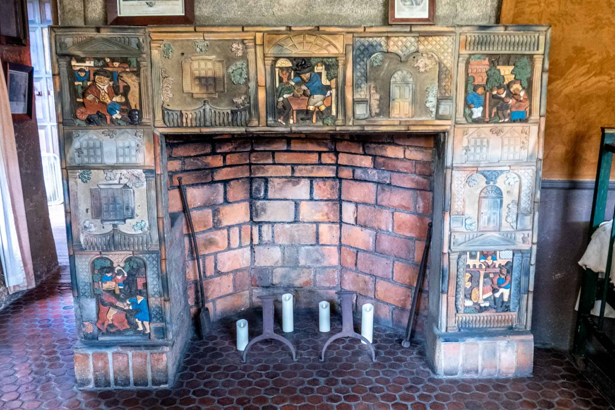 Large fireplace decorated with tiles.