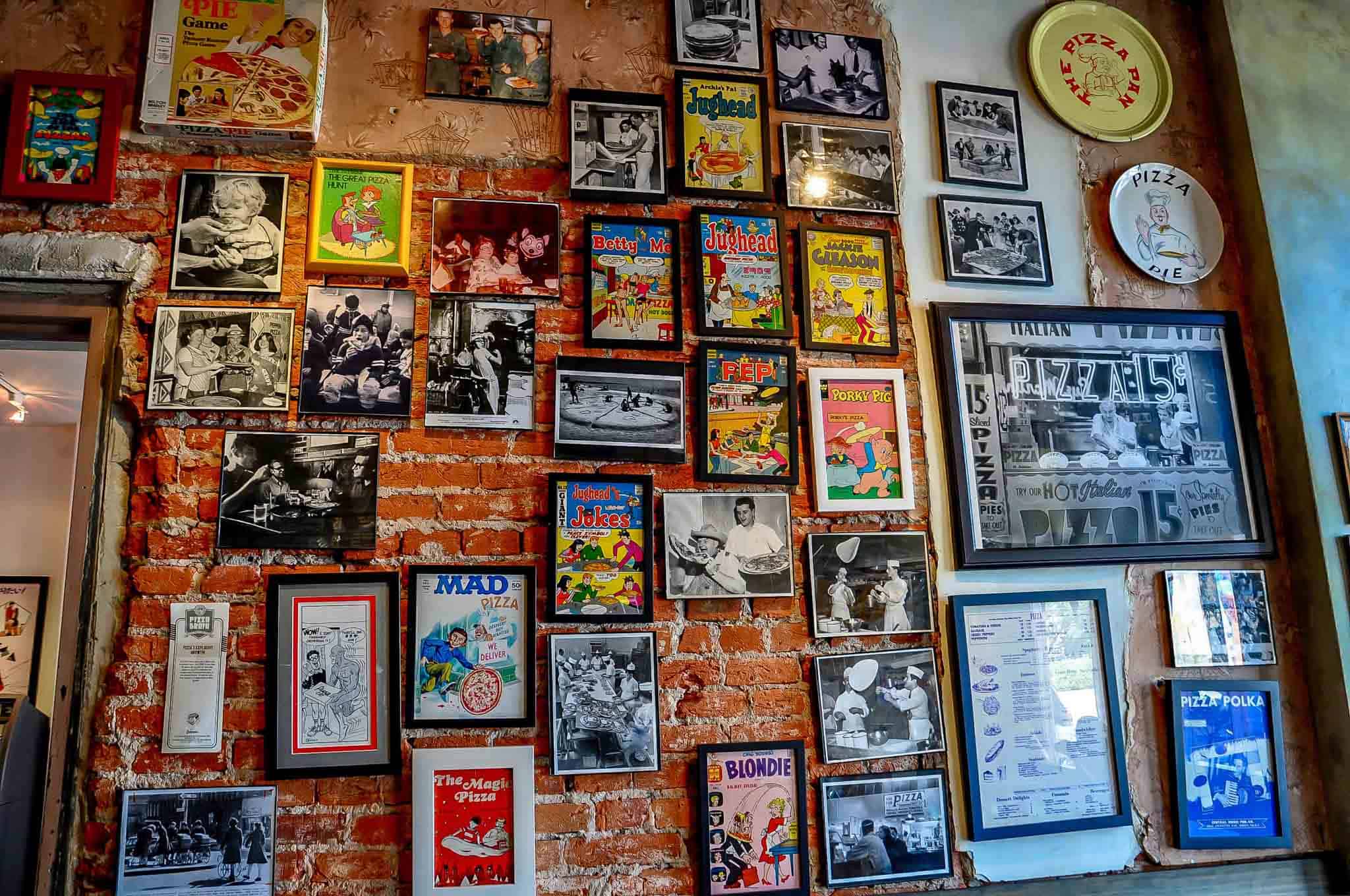 Wall of framed pizza memorabilia at Pizza Brain.