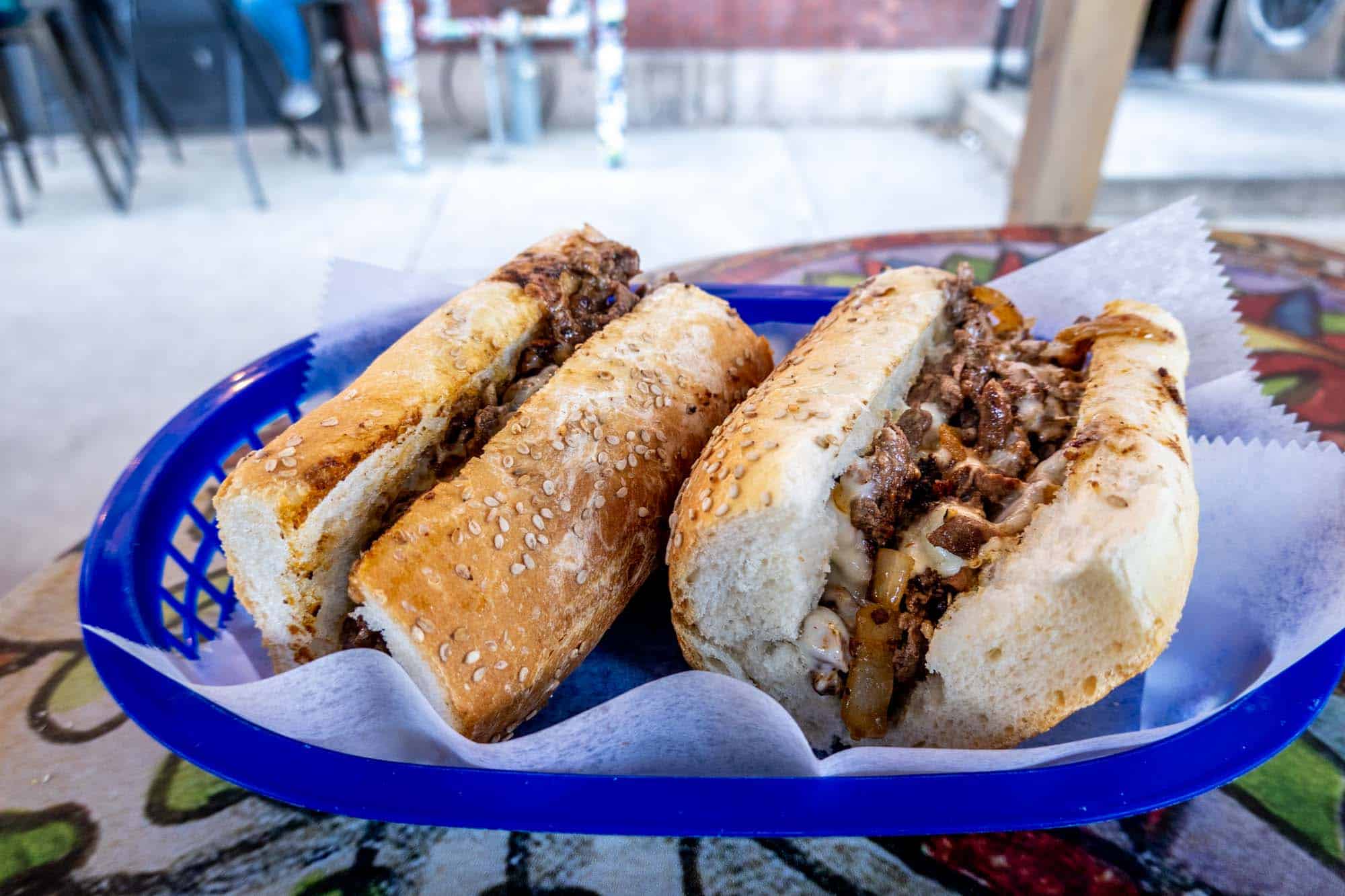 Cheesesteak in a basket on table.