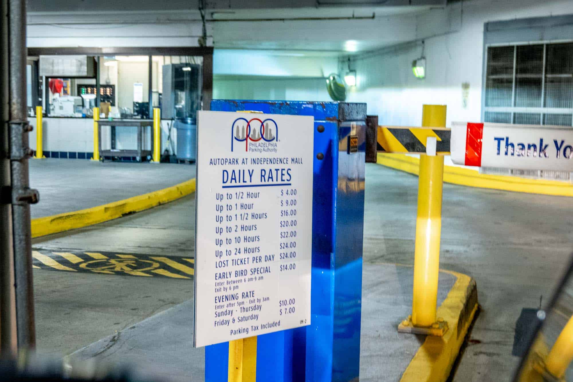 Sign with parking garage rates