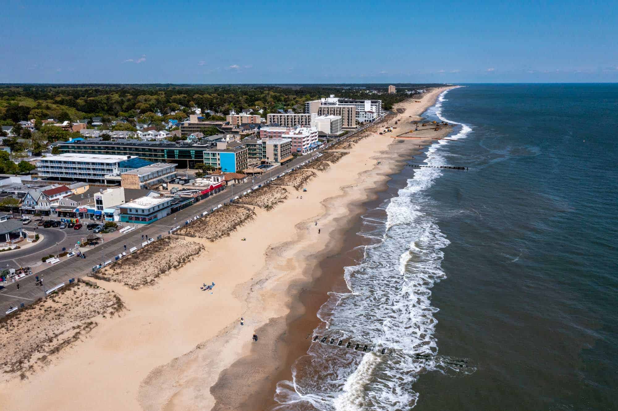 Overhead view of a coastal town, beach, and ocean.