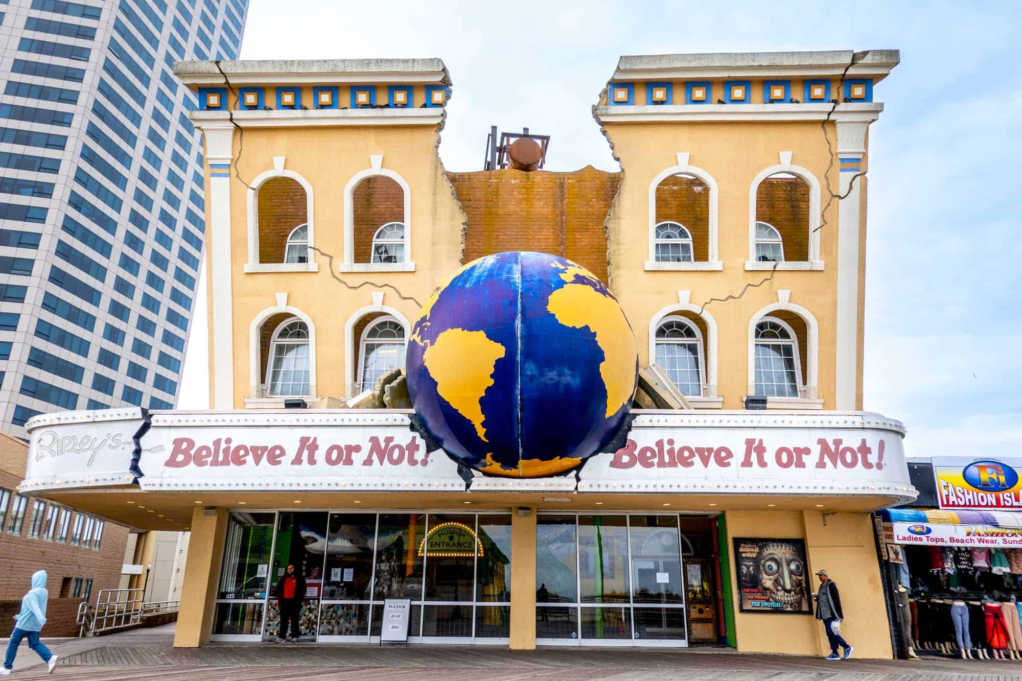 Yellow building with a globe in the middle and a sign for "Ripley's Believe It or Not!"