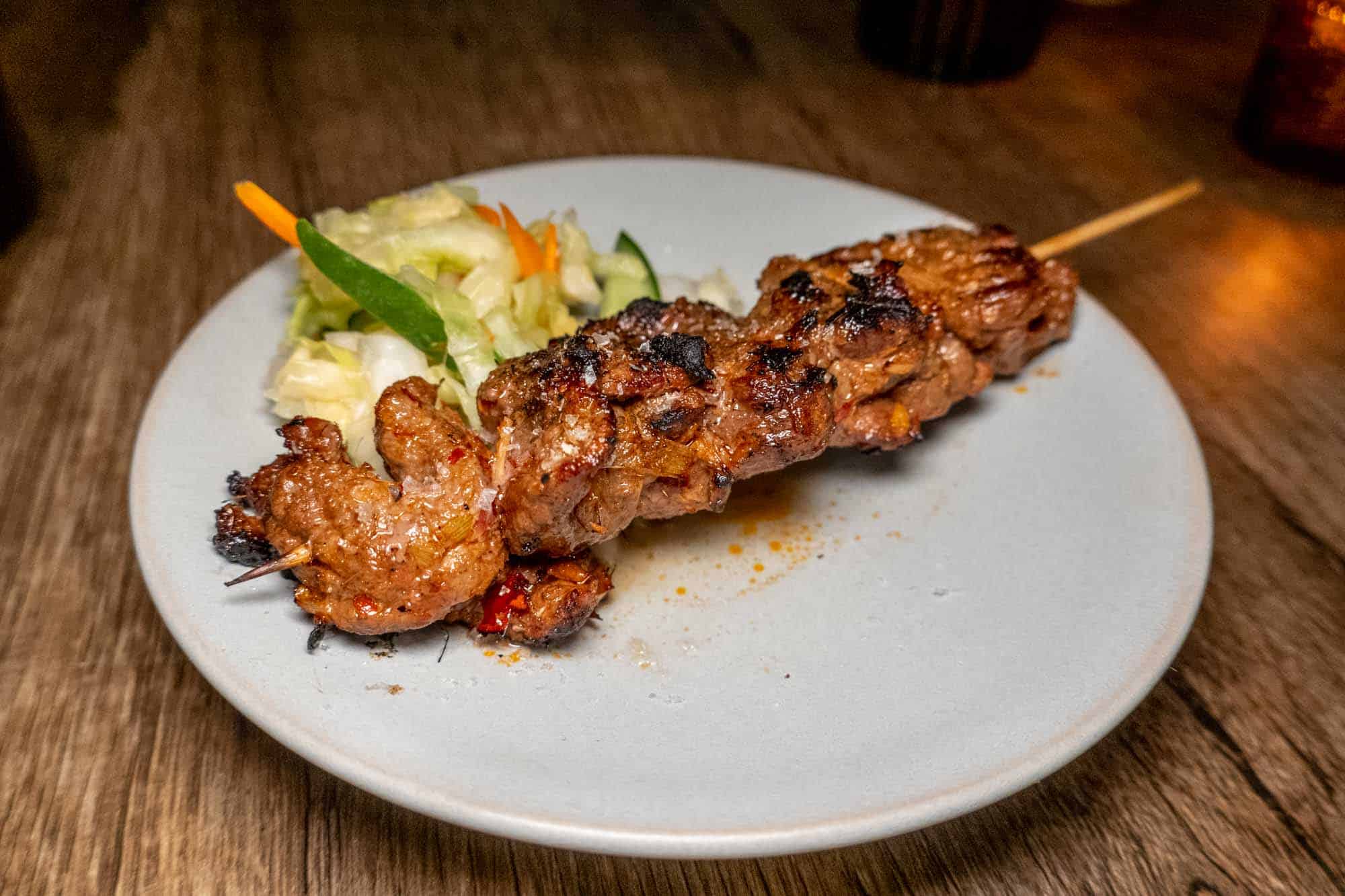 Ribeye steak on wood skewer