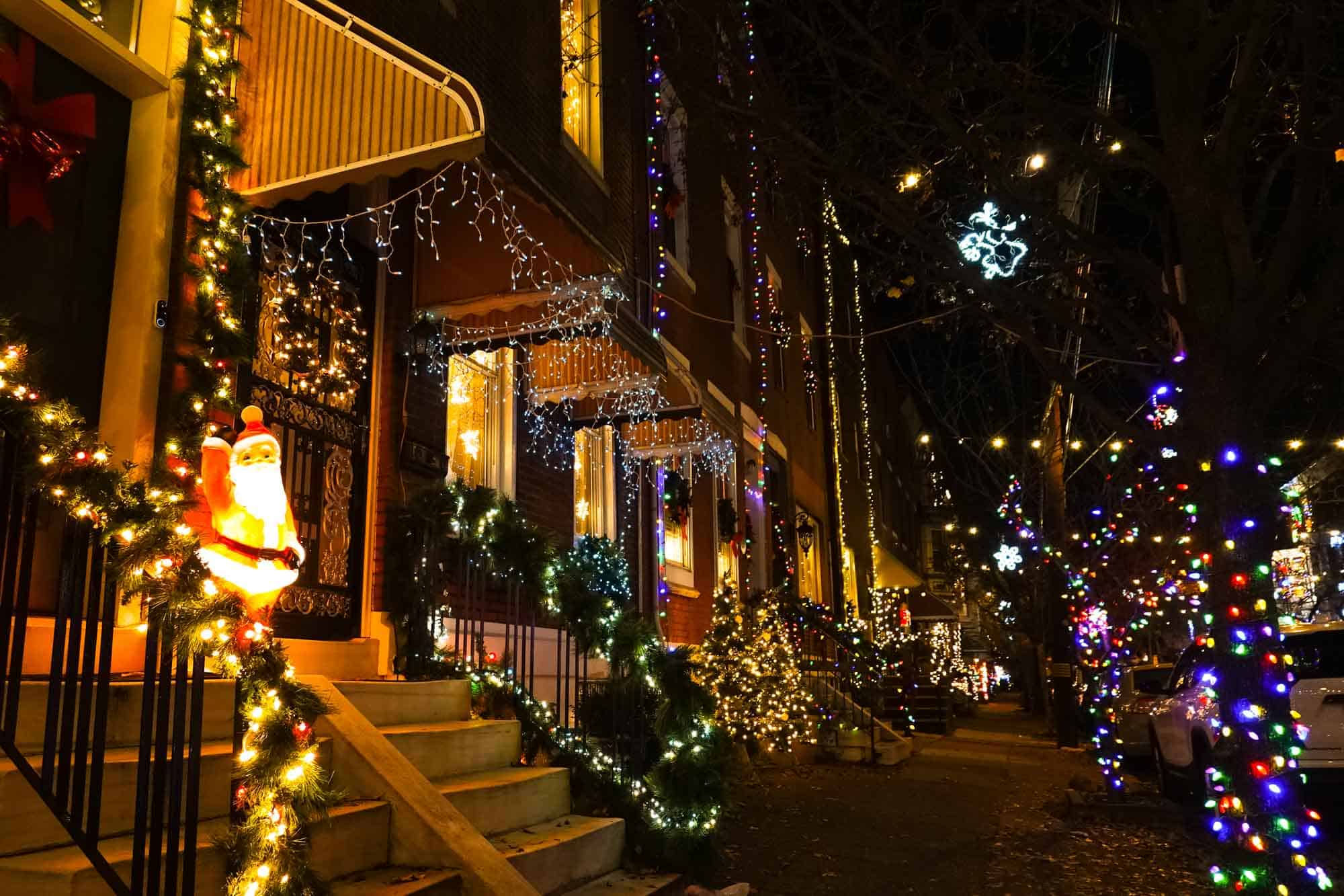 Christmas lights on steps along a city block.