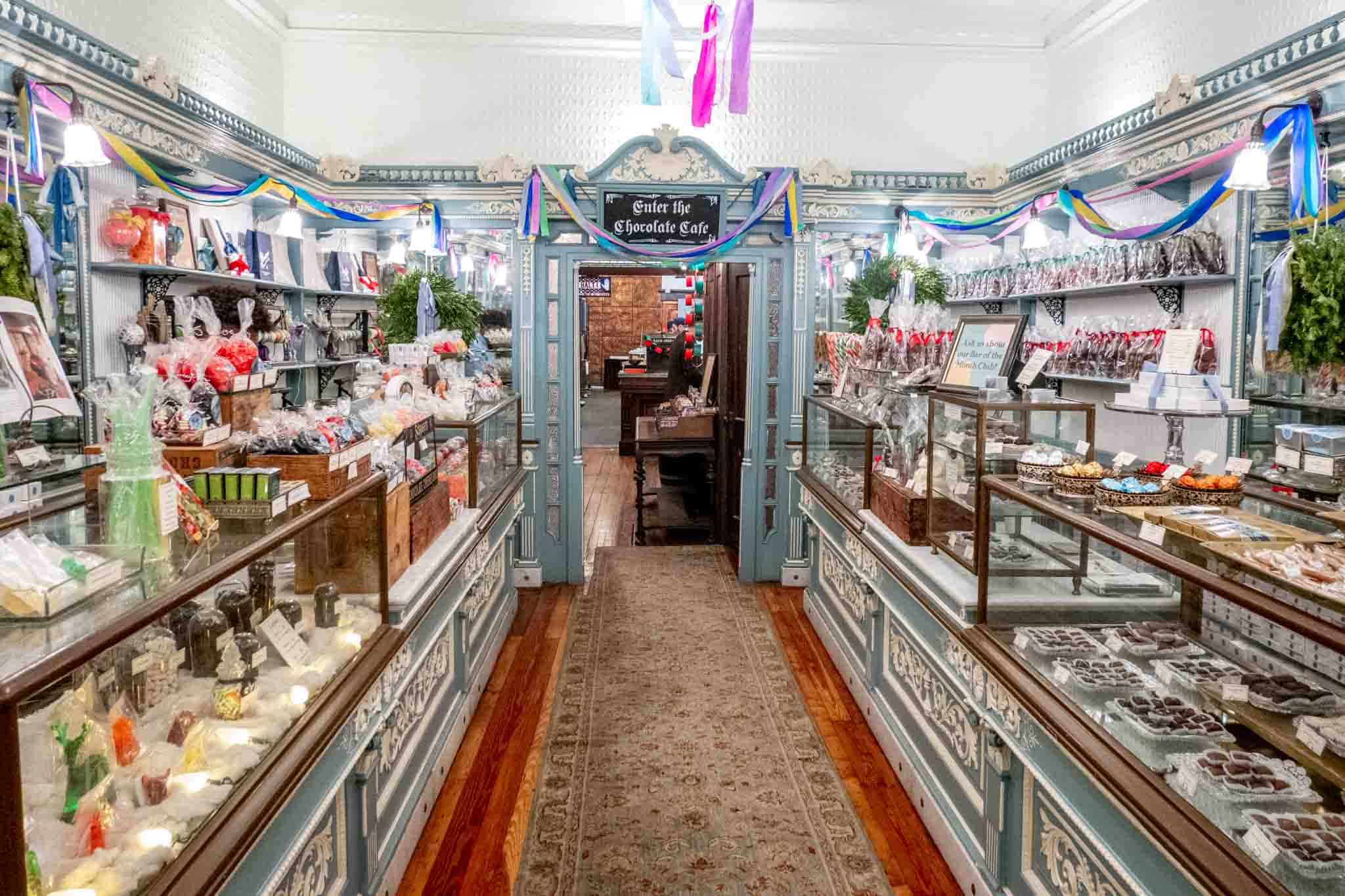 Two parallel candy counters filled with candy and chocolate.