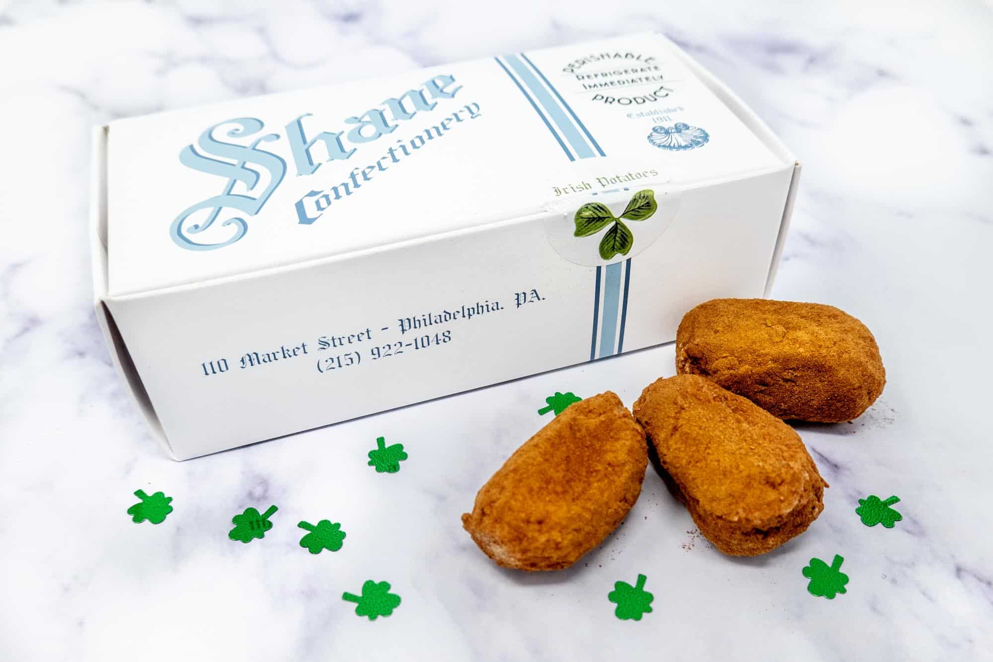 Three Irish potato candies and a box from Shane Confectionary