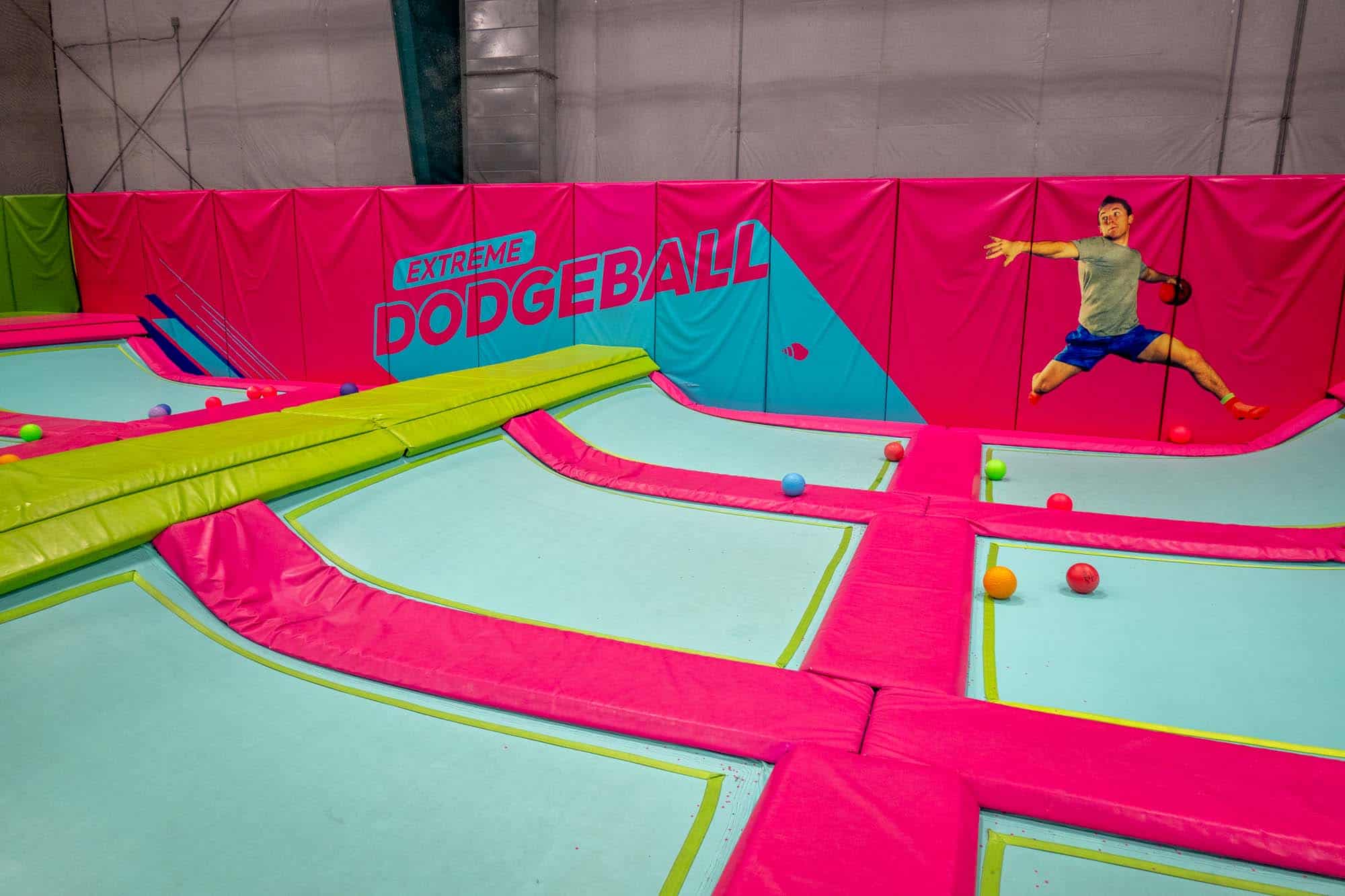 Indoor "extreme dodgeball" court with colorful dodgeballs