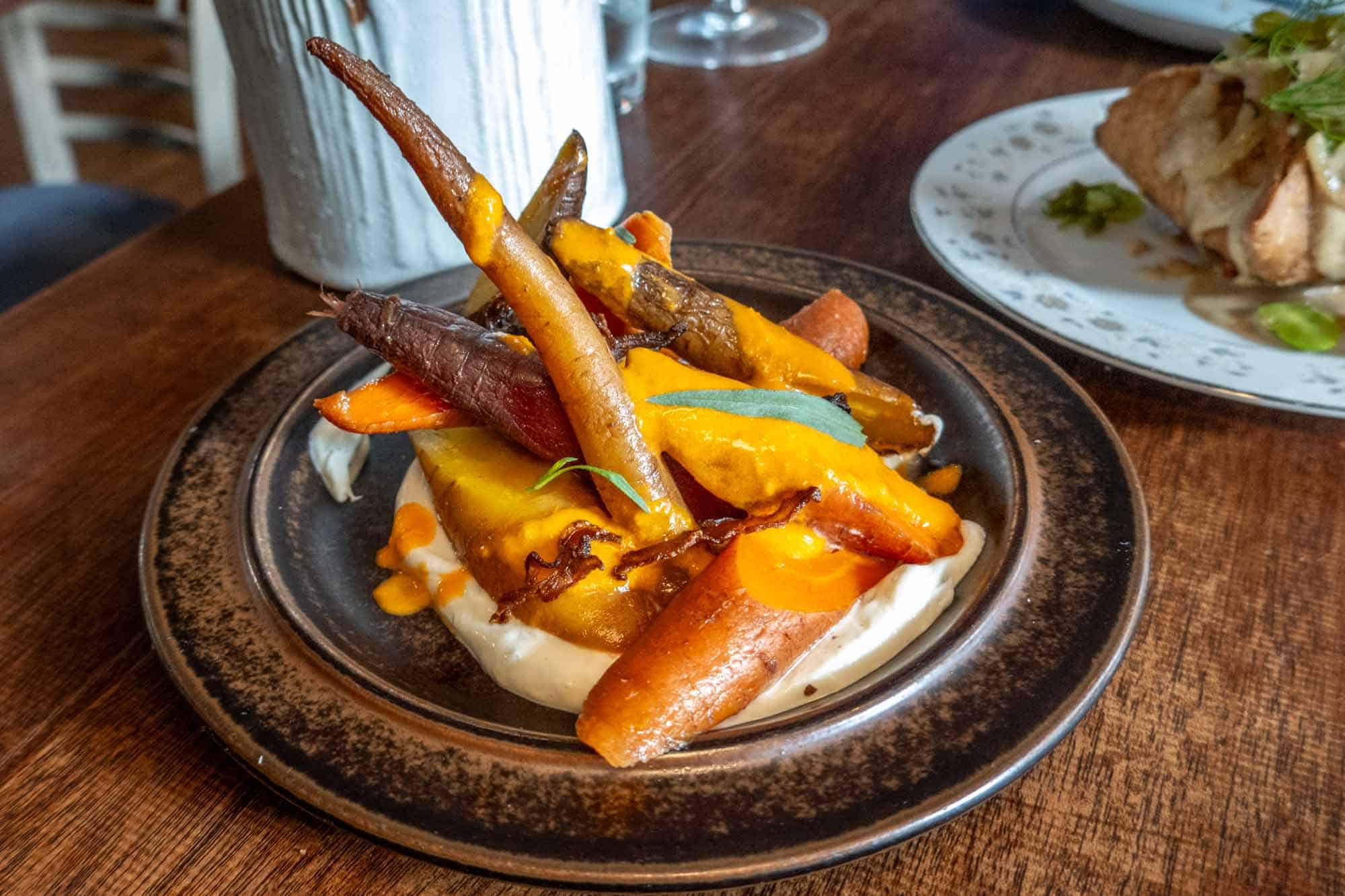 Smoked carrots on a bed of chevre.