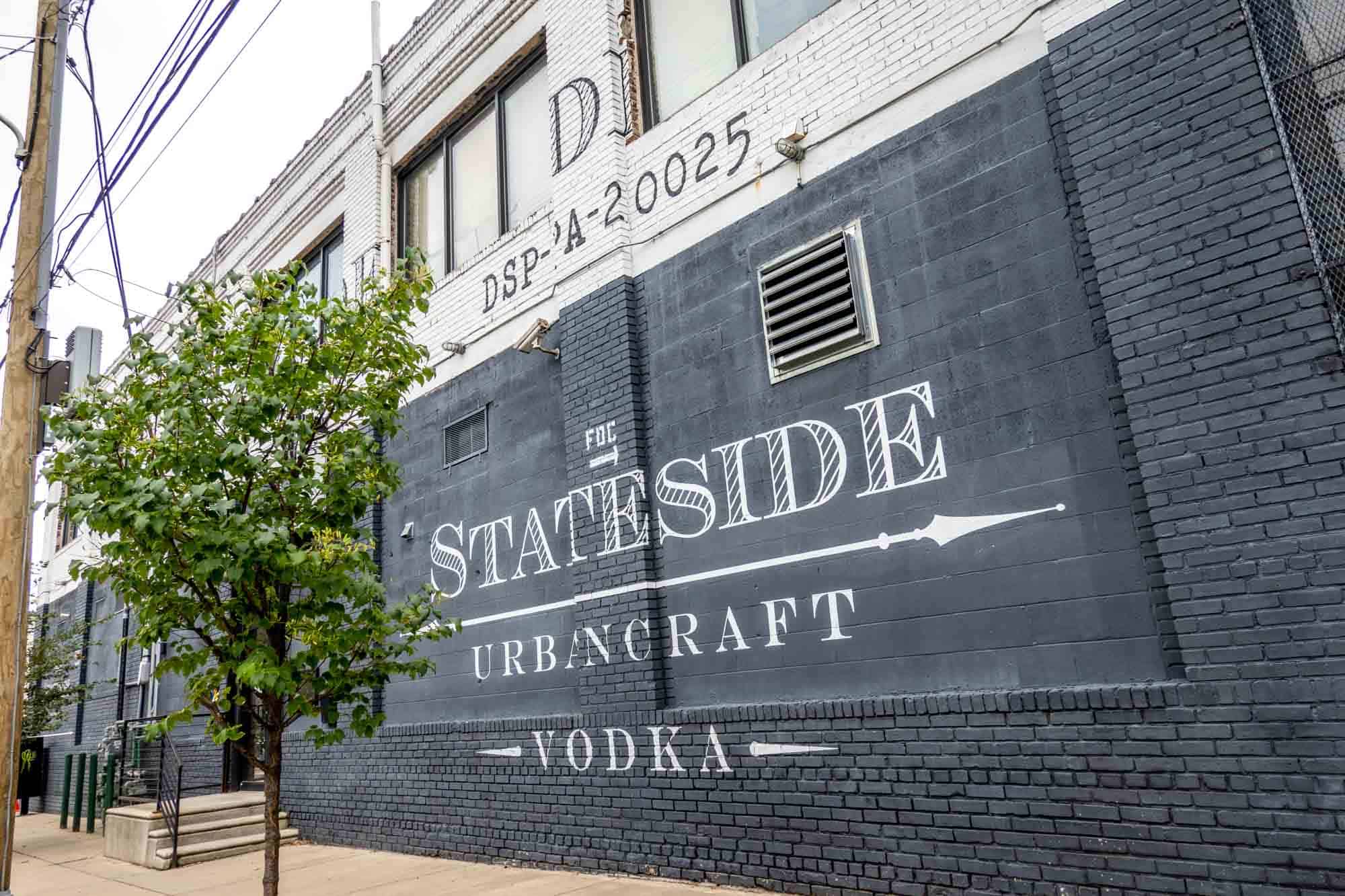 Black wall painted with a sign "Stateside Urbancraft Vodka"