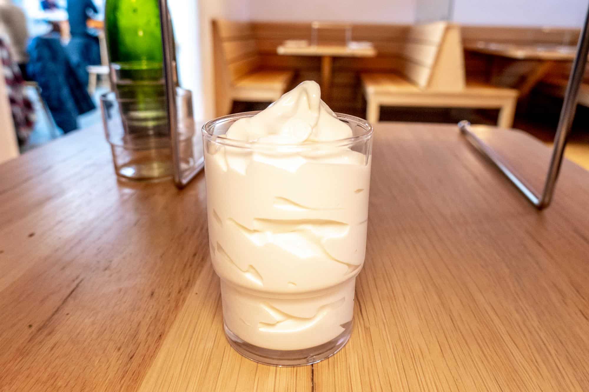 White soft serve ice cream in a glass