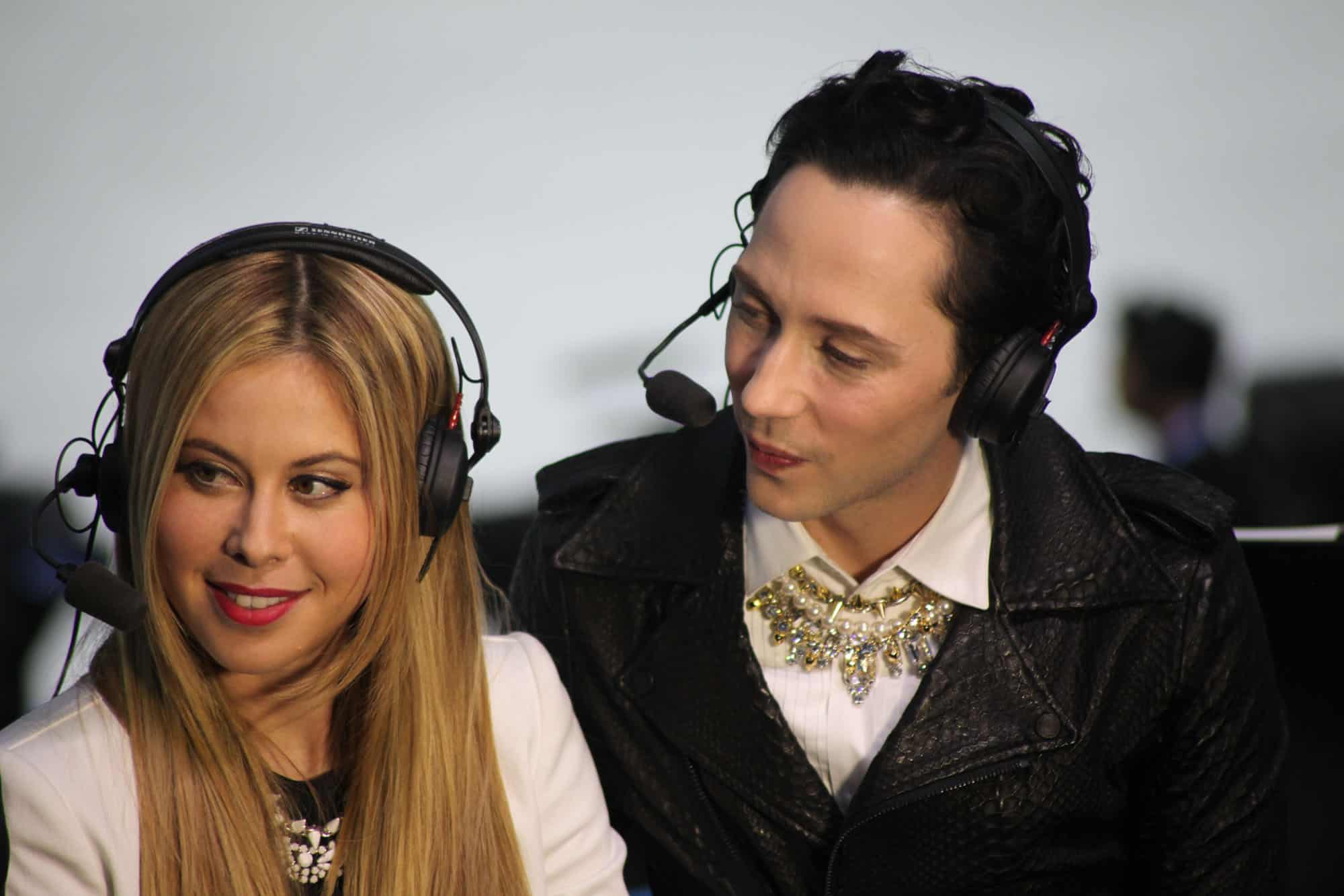 Tara Lipinski and Johnny Weir on TV with headsets