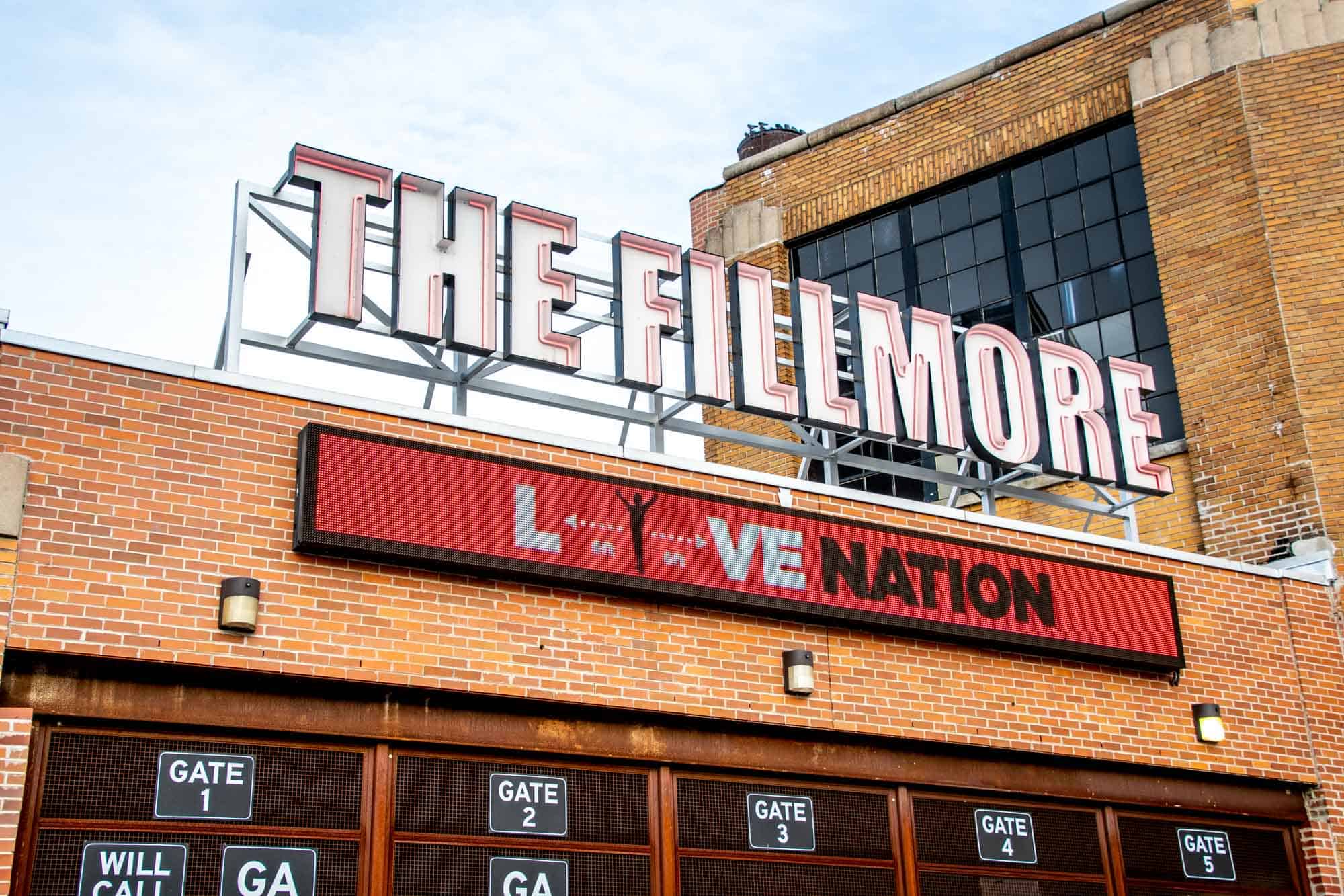 Exterior of a brick concert venue with signage for "The Fillmore" and "live Nation."