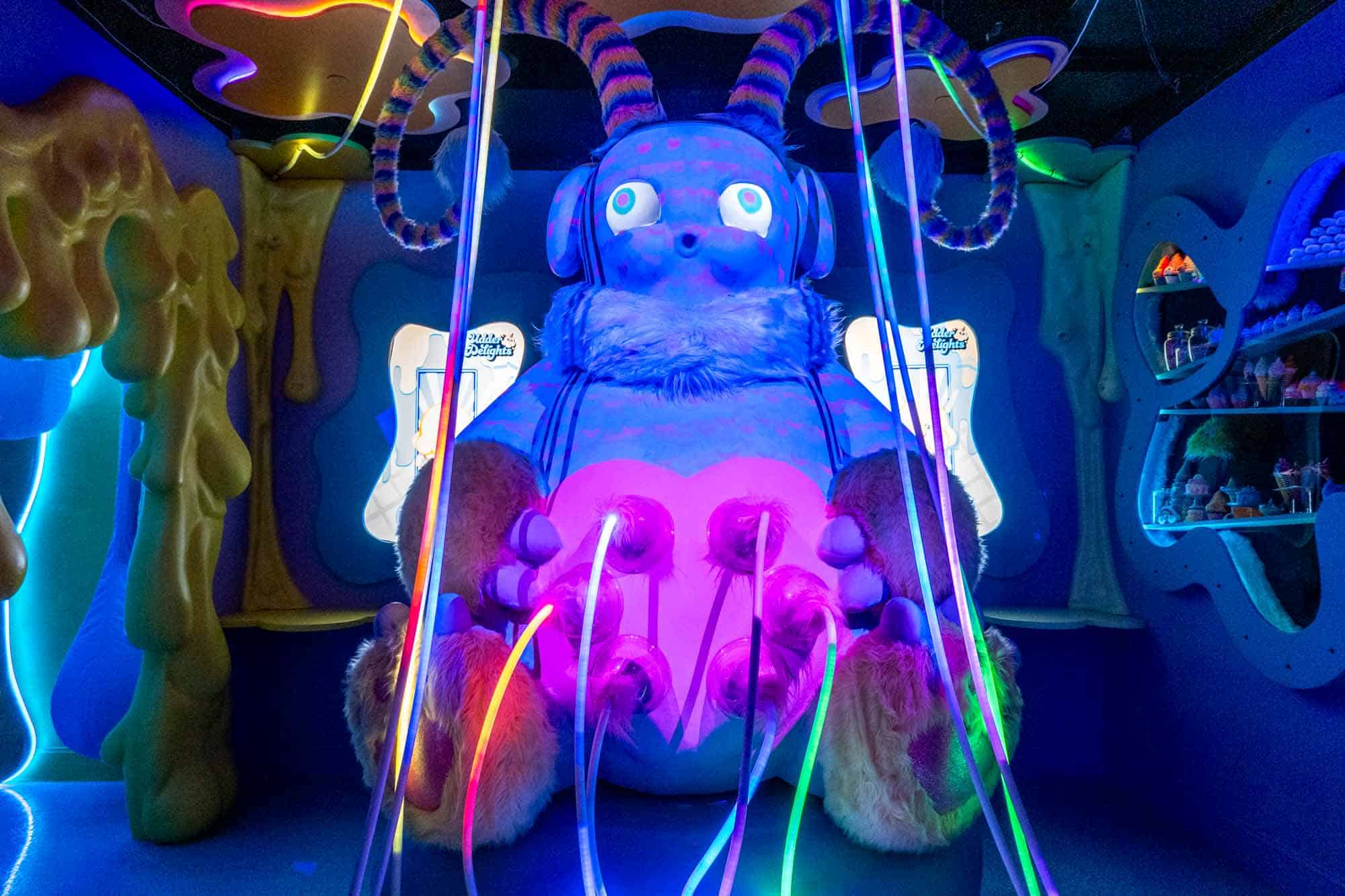 Mythical creature illuminated in black light.