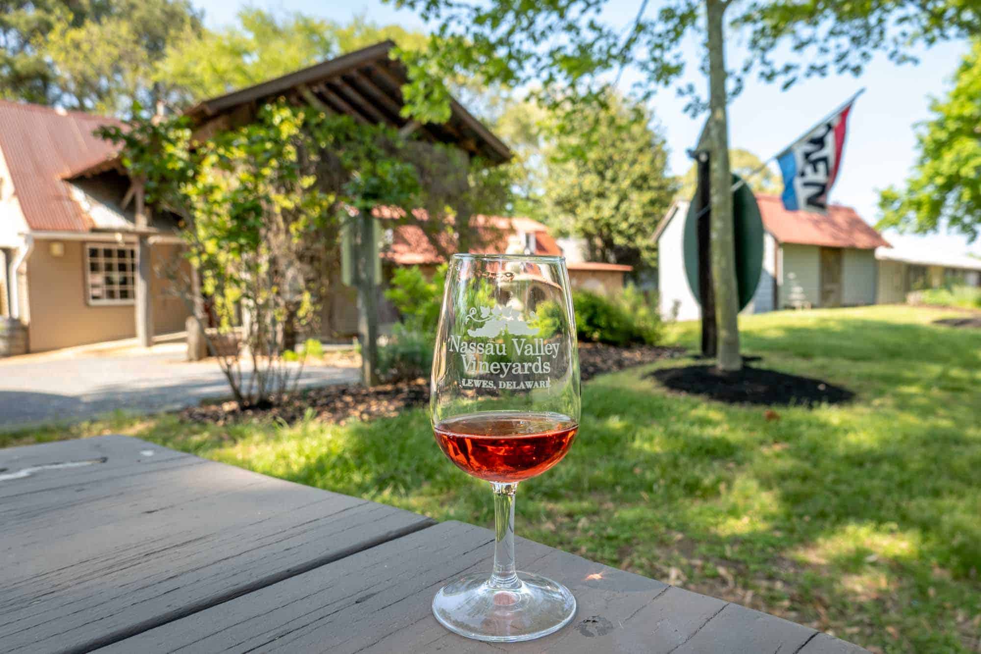 Glass of rose wine on a picnic table