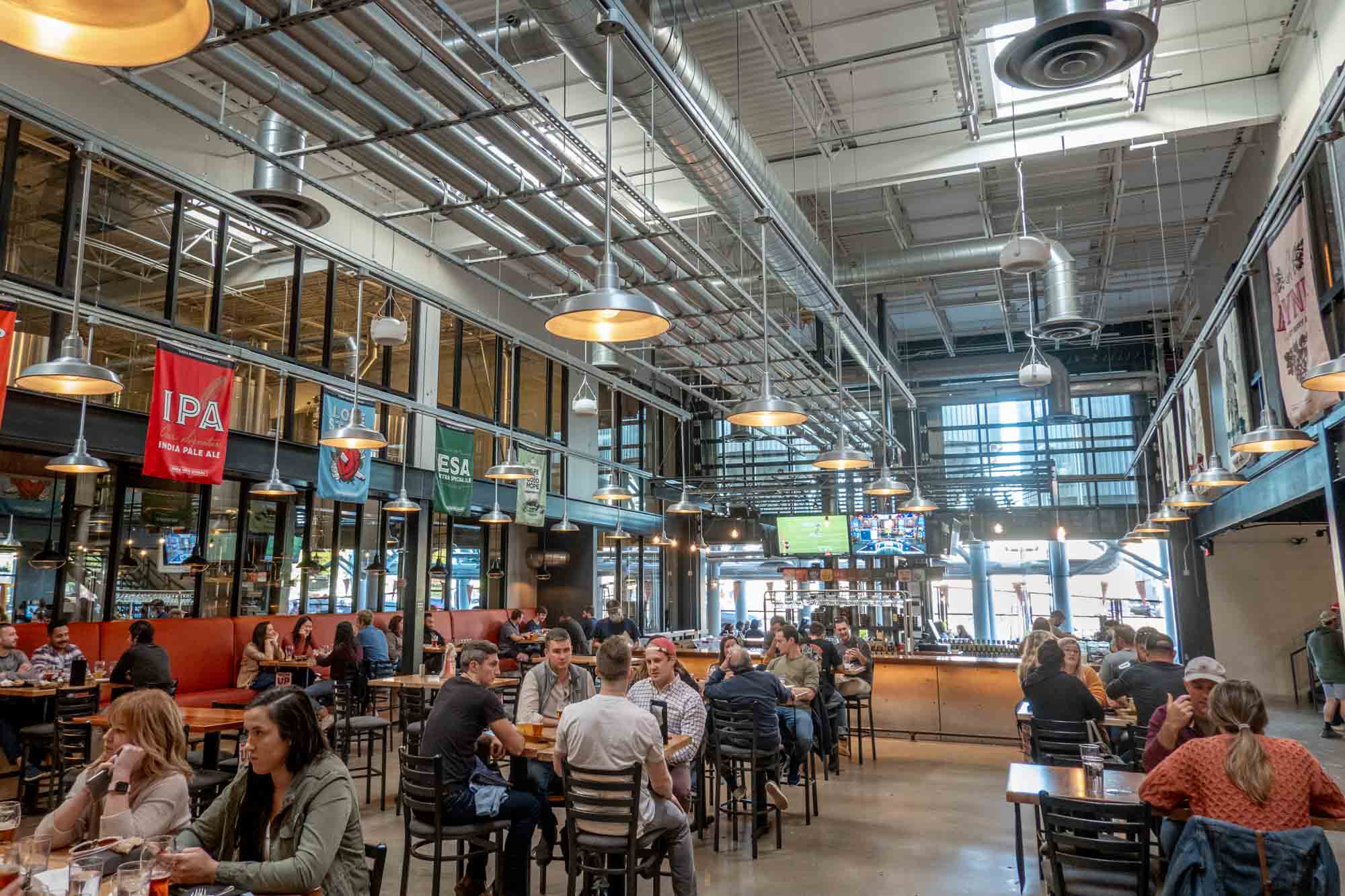 People at tables inside Yards Brewing Company