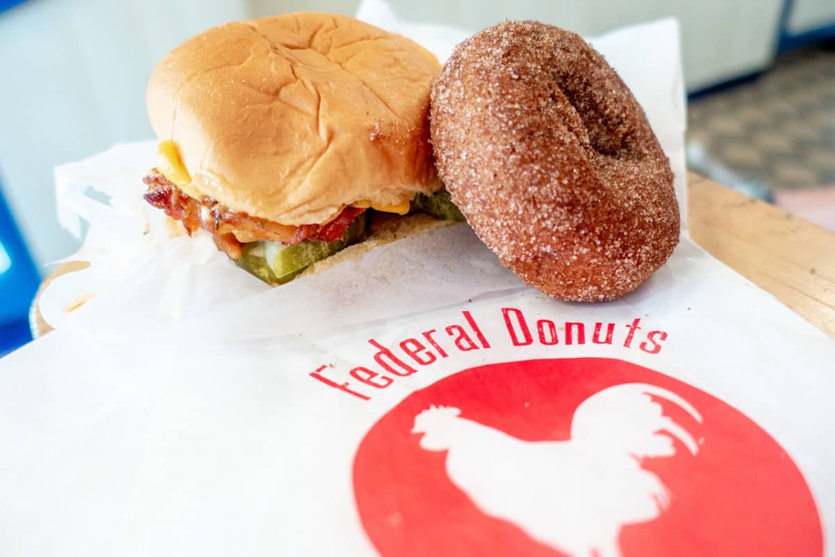 Sandwich and donut on a Federal Donuts bag.